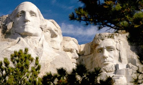 Mt_Rushmore_Close_up_through_trees-1 Mt_Rushmore_Close_up_through_trees-1